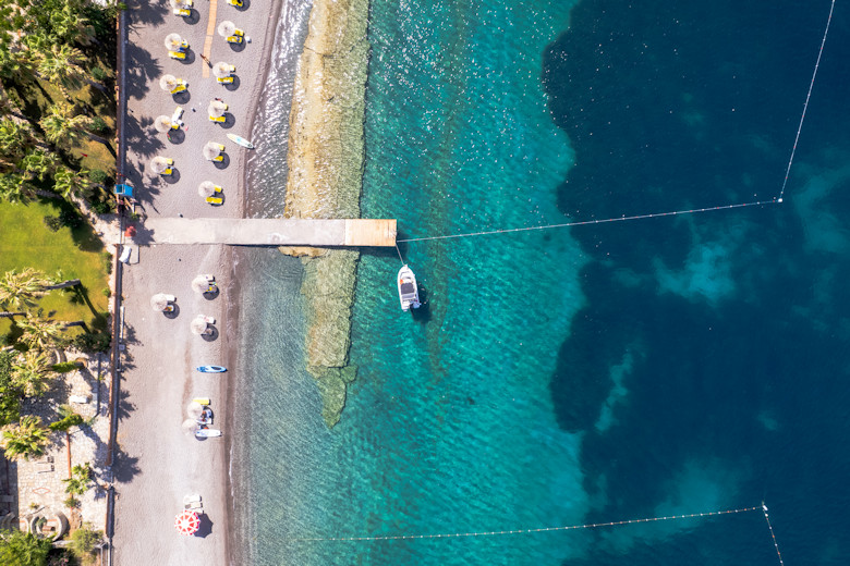 The hotel's jetty and beach from above