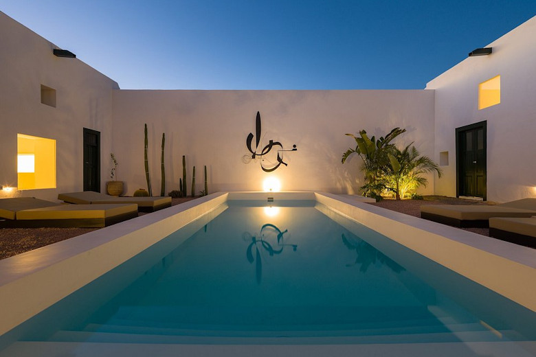 The pool and patio by night