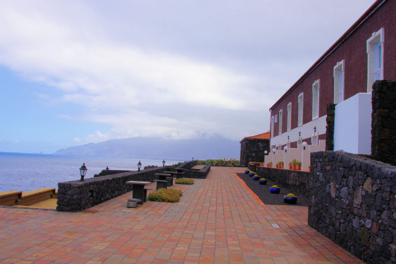 The hotel stands next to the sea